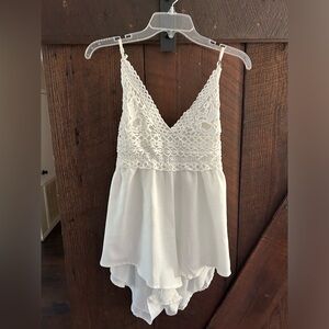 White lace open back romper. Worn once. Size small.